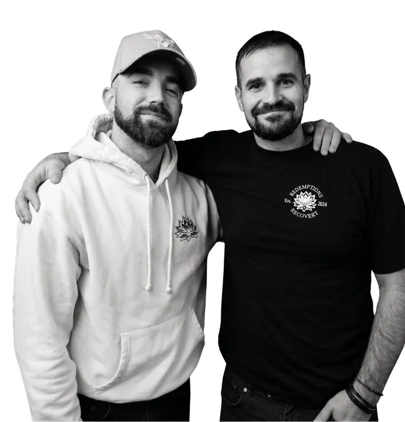 Two Redemptions Recovery team members standing side by side.